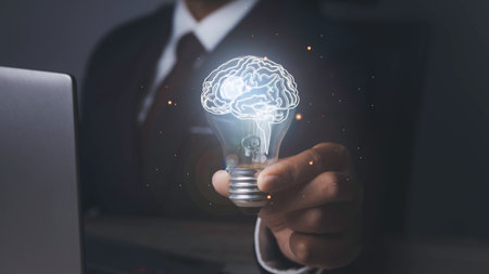 Businessman holding light bulbs with brainstorming creative idea and innovation. Idea, Brainstorm, Innovation and digital transformation change management, internet of things.の写真素材