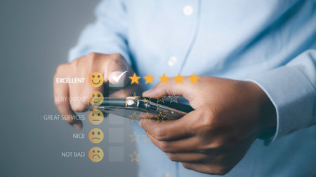 Customer satisfaction experience concept. Businessman using mobile phone giving high score with five...