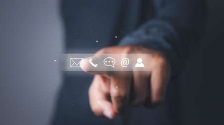 CONTACT US, Businessman access connect by touching contact icons support hotline people connect. ( email, address, live chat, internet wifi ). Customer service call center concept. copy space.の写真素材