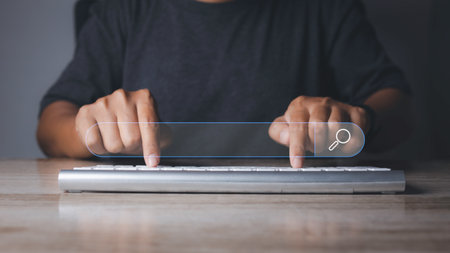 Searching browsing internet data information networking concept. Search Engine Optimization SEO Networking. Man hand presses the information search button on search bar virtual screen, copy space.の写真素材