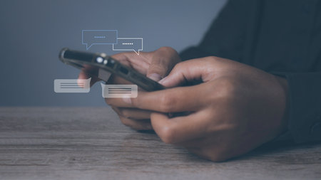 Young man using smartphone with social media to interactions icon on internet post. Data and marketing concept. Social media and digital online on mobile phone.の写真素材