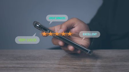 Customer satisfaction experience concept. Businessman using mobile phone giving high score with five...