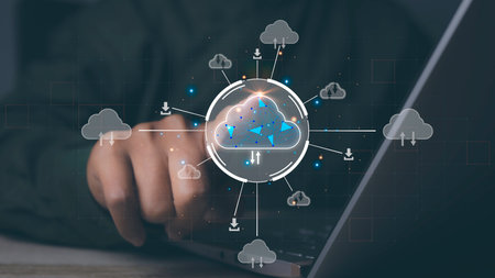 Businessman using computer laptop access cloud computing technology. Data storage security online in Networking and internet service. Connect devices to cloud. Cloud computing concept.の写真素材