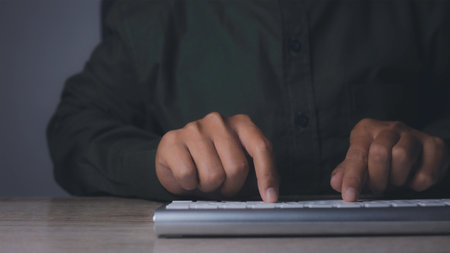 Businessman using keyboard computer working on office table. copy space..の写真素材