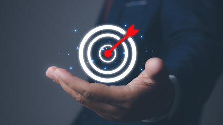 Businessman holding arrow dart icon. Digital marketing business goal and technology. Management...