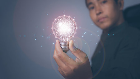 Man holding light bulbs the new ideas with innovation technology and creative. Business, Development, Concept creativity with bulbs that shine glitter.の写真素材