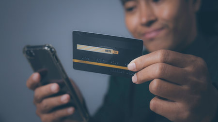 Businessman using mobile phone and credit card shopping online. Shopping online by credit card with...