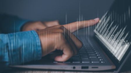 Businessman using laptop with forex trading graph financial data. Goal business success strategy chart target and planning. Stock market, financial graph growth report, business development.の写真素材