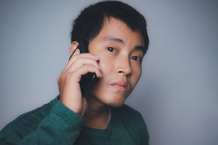 Young man using mobile smartphone. copy spaec.の写真素材