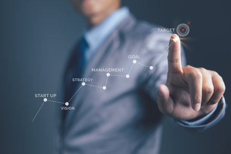 Businessman hand pointing startup in progress business growing potential with graph on target. Business growth, progress or success.の写真素材