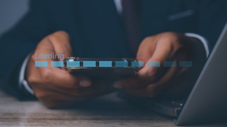 Businessman using computer for loading data application. download bar digital business data website. Concept of waiting for loading bar.の写真素材