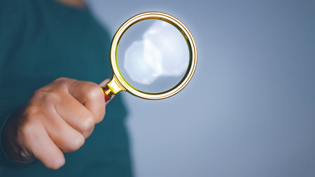 Businessman using magnifying glass searching data. Information in the internet world search technology Search Engine Optimization(SEO).の写真素材