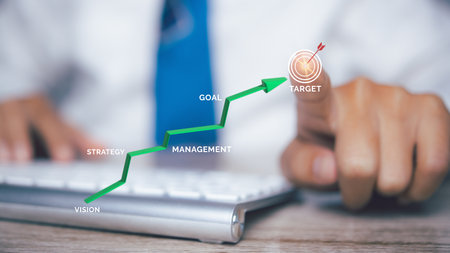 Businessman hand pointing target in progress business growing potential with graph on target....