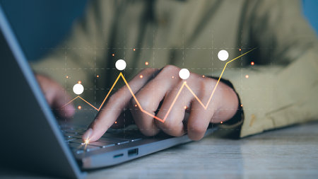 Businessman using laptop with forex trading graph financial data. Goal business success strategy...