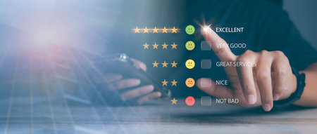 Man using smart phone choosing happy smile face positive mindset selection for feedback review satisfaction service. rating very impressed. Best quality. Customer satisfaction experience concept.の写真素材