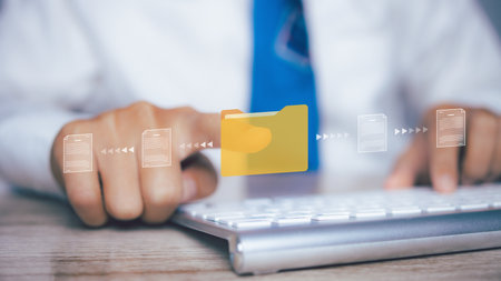Document Management System (DMS), Businessman access folder and document icon software, searching and managing files online document database, for efficient archiving and company data.の写真素材
