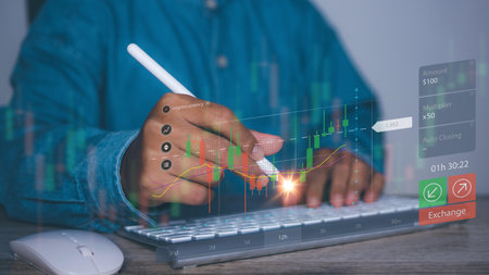 Businessman using computer access forex trading graph financial data. Goal business success strategy chart target and planning. Stock market, financial graph growth report, business development.の写真素材