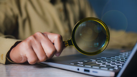 Businessman using magnifying glass searching data. Information in the internet world search technology Search Engine Optimization(SEO).の写真素材