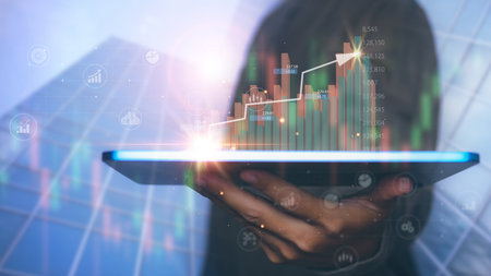 Businessman using tablet with forex trading graph financial data. Goal business success strategy...