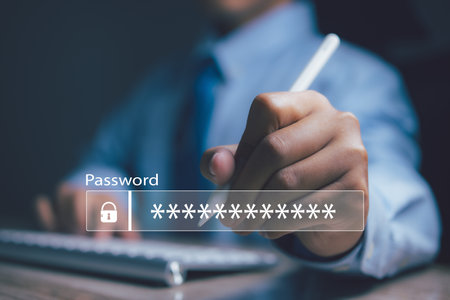 Businessman using computer input password. Technology security system and prevent hacker concept.の写真素材