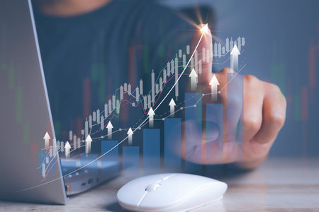 Businessman using laptop trading forex stock market. Business financial data.の写真素材
