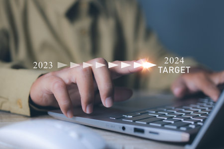 Businessman pointing target in 2024. Progress business growing potential successの写真素材