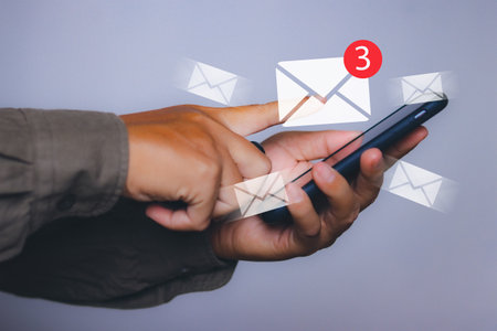 man with new email notification for business e-mail communication by smartphoneの写真素材