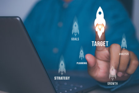 Businessman pointing rocket icon new business start up 2024. Growing to target.の写真素材