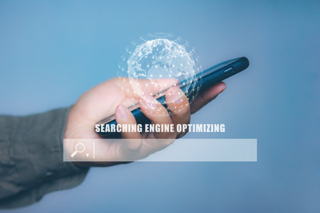 Businessman using smartphone to optimize online content with SEO tool with search bar.の写真素材