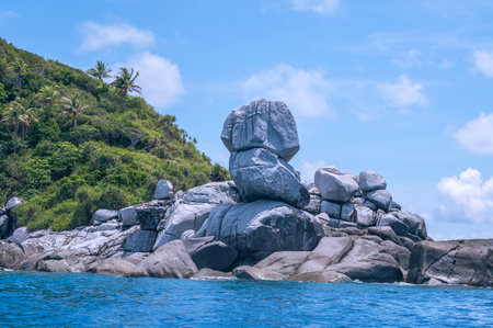 Large granite rock on the seashore of a tropical island.の写真素材