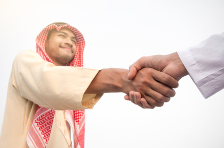 Arab businessman shake hand on white backgroundの写真素材