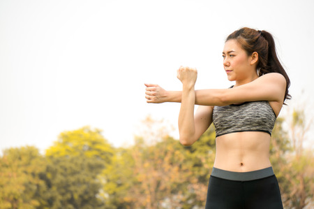 Asian beauty woman exercise and stretching in park outdoor in cityの写真素材