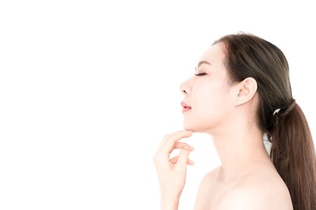 Asian beauty women present skin for skin care product on white backgroundの写真素材