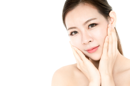 Asian beauty women present skin for skin care product on white backgroundの写真素材