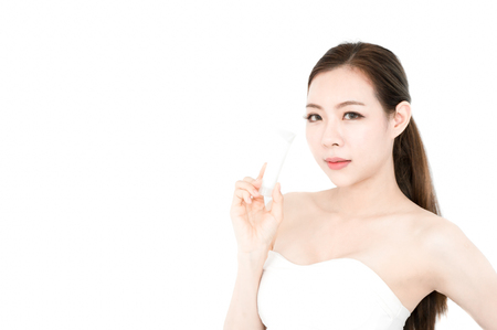 Asian beauty woman present skin product on white backgroundの写真素材