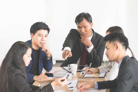 Businessman and woman discuss during meeting in office on white backgroundの写真素材