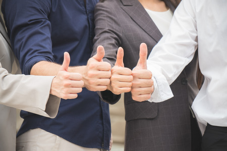 Businessman and woman cooperate teamwork together successful and achievement in city on building backgroundの写真素材