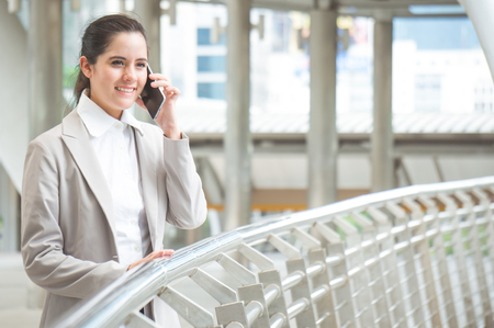 Business woman calling in cityの写真素材