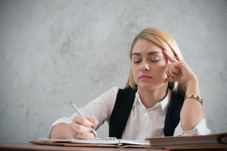 Business woman stress and bore during working in officeの写真素材