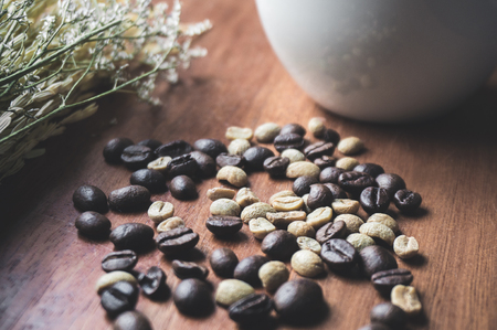 Coffee bean texture closeup with coffee cup for advertisementの写真素材