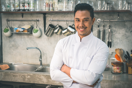Asian chef / cook in kitchen of restaurantの写真素材