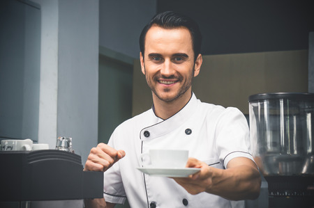 Barista taste coffee and invite customer to tasteの写真素材