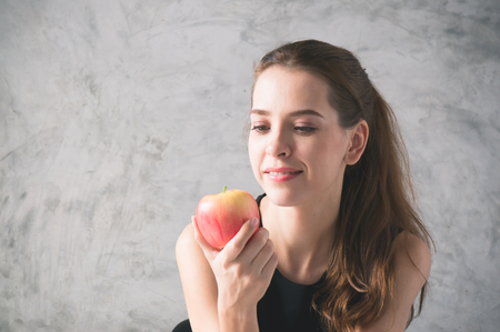 Healthy woman eat red apple for healthの写真素材