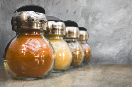 Cinnamon in bottle set on tableの写真素材