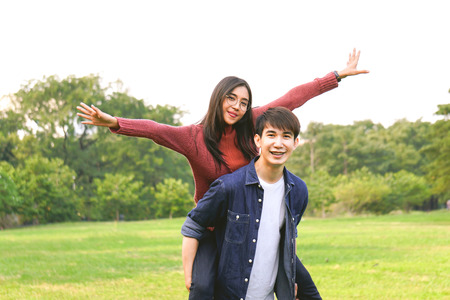 Asian love couple in park with happiness, laugh and smile