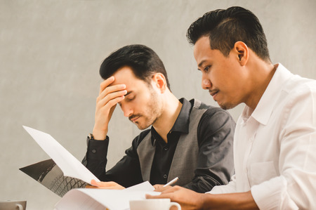 Businessman stress during meeting in officeの写真素材