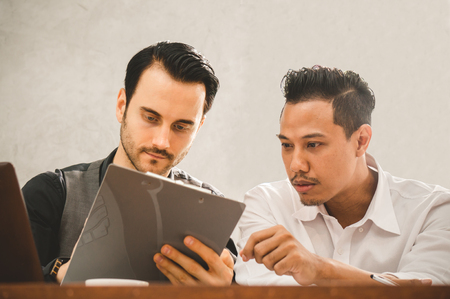 Businessman discuss with colleague in office meeting roomの写真素材
