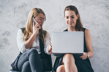 Working women discuss in office during coffee breakの写真素材