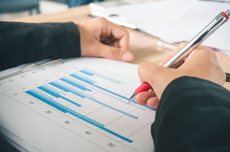 Businessman present graph report for targetの写真素材