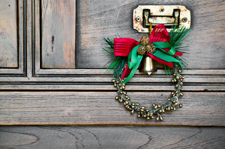 Cute Wreath with tiny bell for Christmastime party for happy new year in vintage styleの写真素材